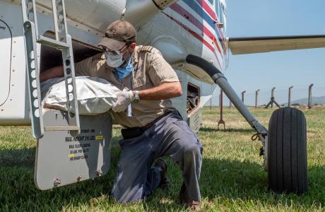 Pilot unloading supplies